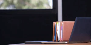 FDA 510(k) clearance preparation with laptop and organized files.