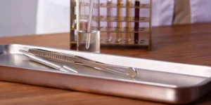 FDA food facility registration paperwork on a stainless steel clipboard.