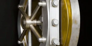 A secure vault door protecting a supplier audit program.