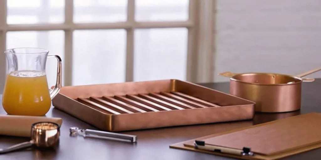 A glass pitcher of juice on a table, the subject of a detailed juice HACCP plan.