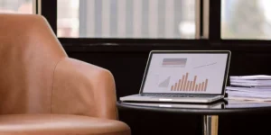 Laptop on a table showing data analysis for a 505(b)(2) pathway consulting strategy.