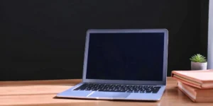 Desk with a laptop and documents for planning a SaMD regulatory strategy.