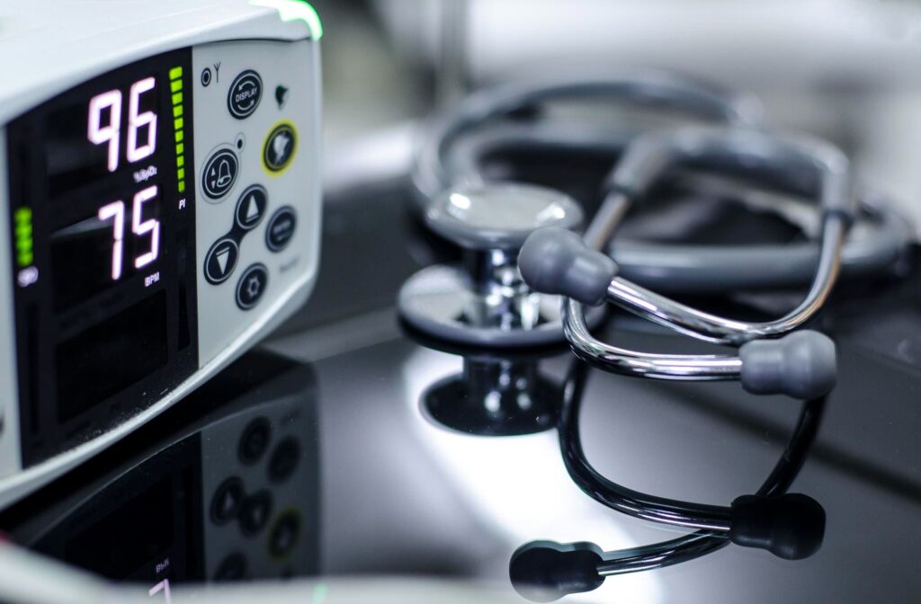 Close-up of a vital signs monitor and a stethoscope.