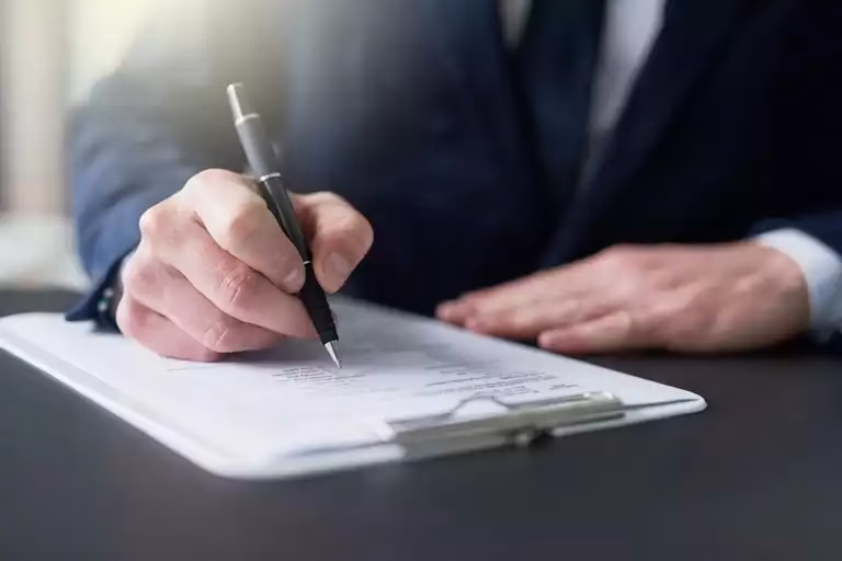 A person signing a compliance document