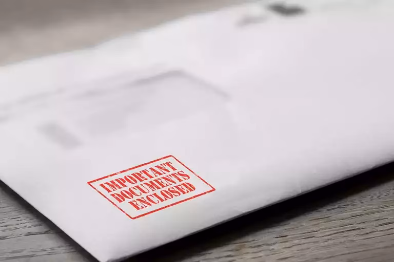 An envelope marked “Important Documents Enclosed”