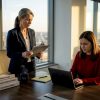 Quality manager reviews audit checklist at office table