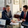 Consultant reviews pharma regulatory timeline in office